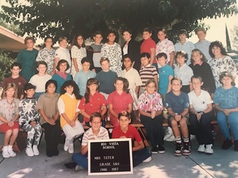 Mike Garcia posing with his 6th grade class.